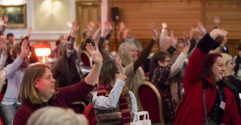 people with hands in the air