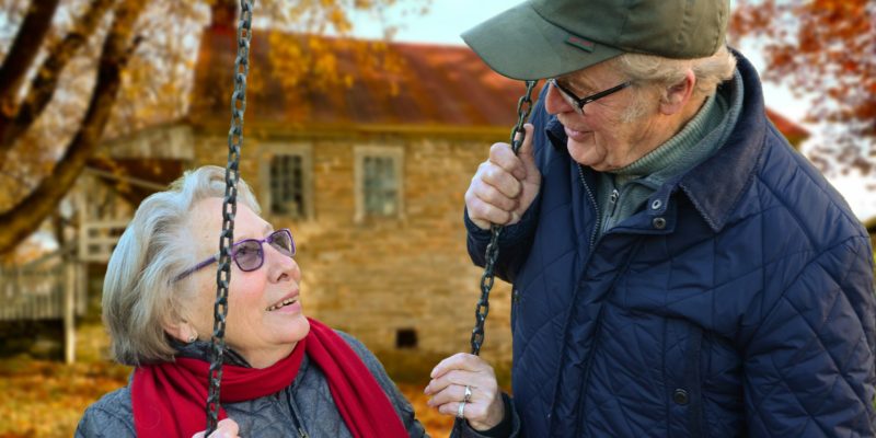 Older lady smiling at older man