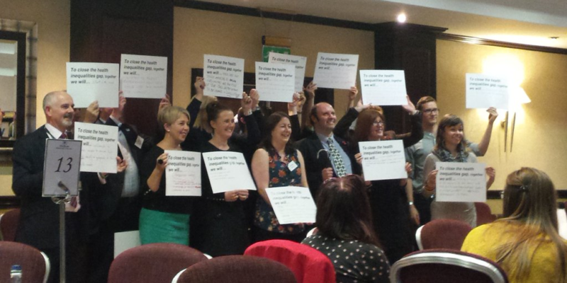 people holding signs